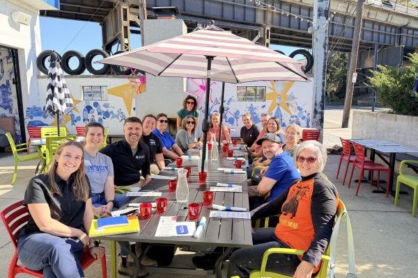 a group of people sitting at a table