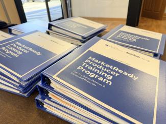 stack of training binders